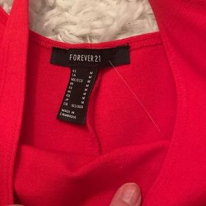 Right body fitting knee length red dress